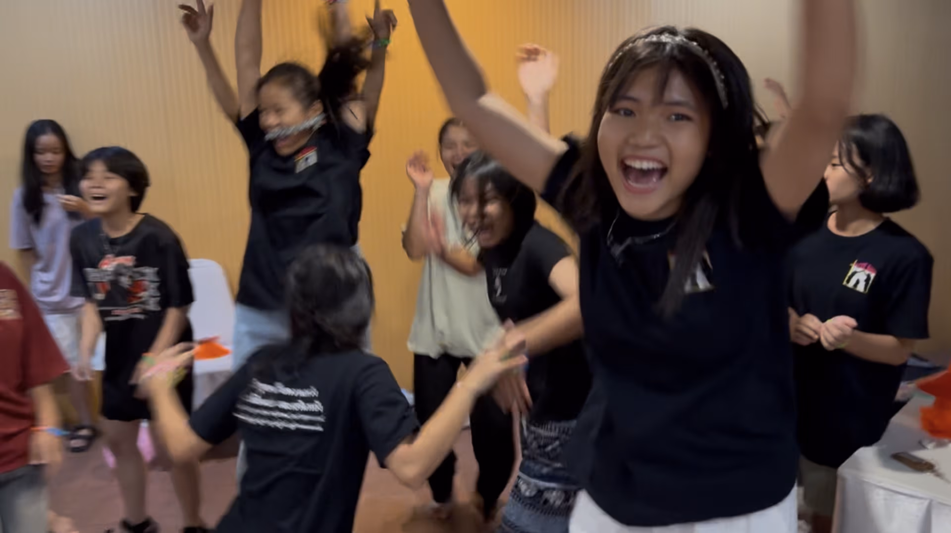 The Faith House girls celebrating and cheering during games